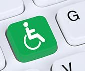 Green accessibility button integrated into a computer keyboard