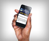 Man holding phone with NTP newsletter on screen